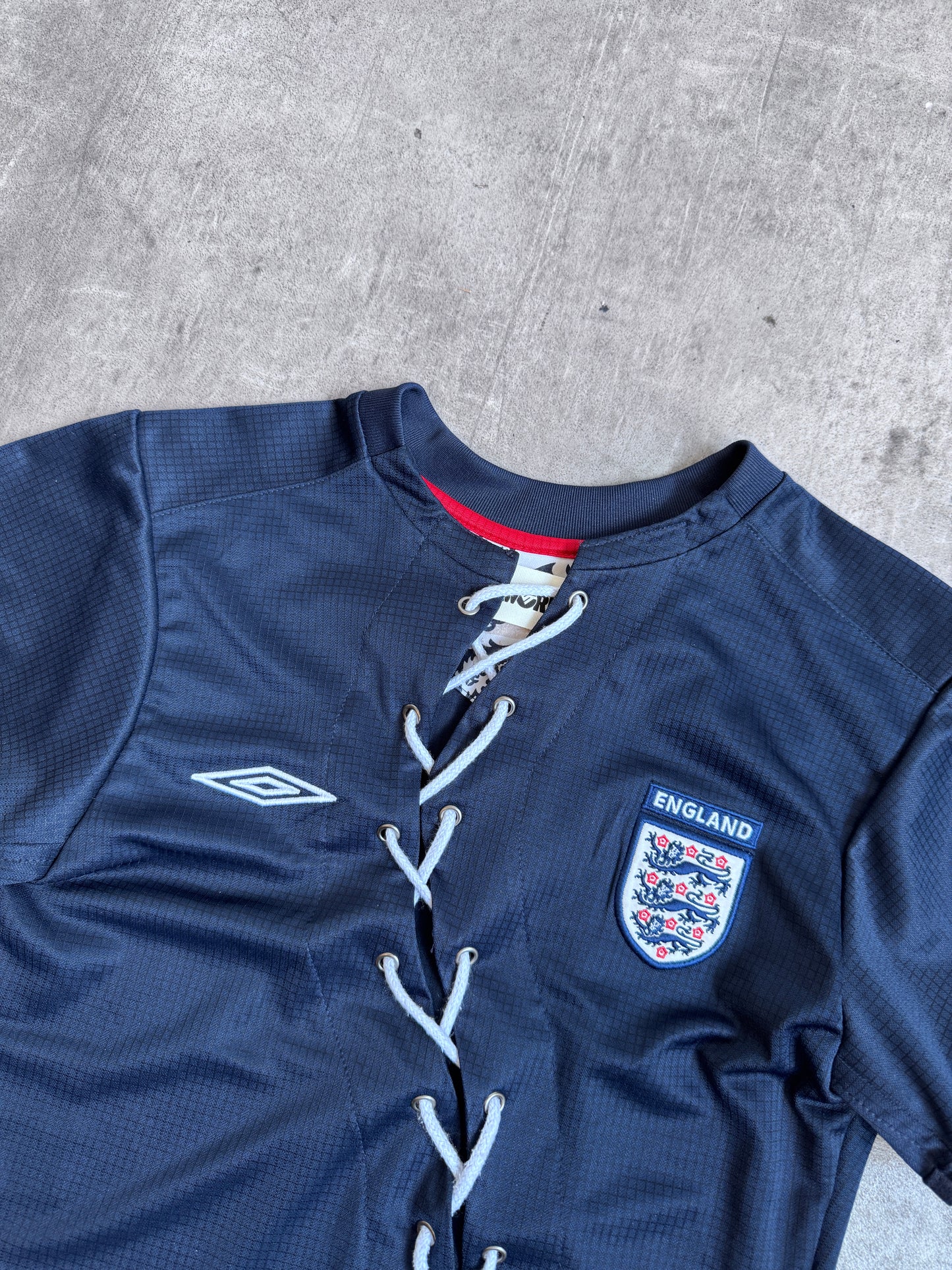 VT Rework: England Navy Asymmetric Lace Front Tee